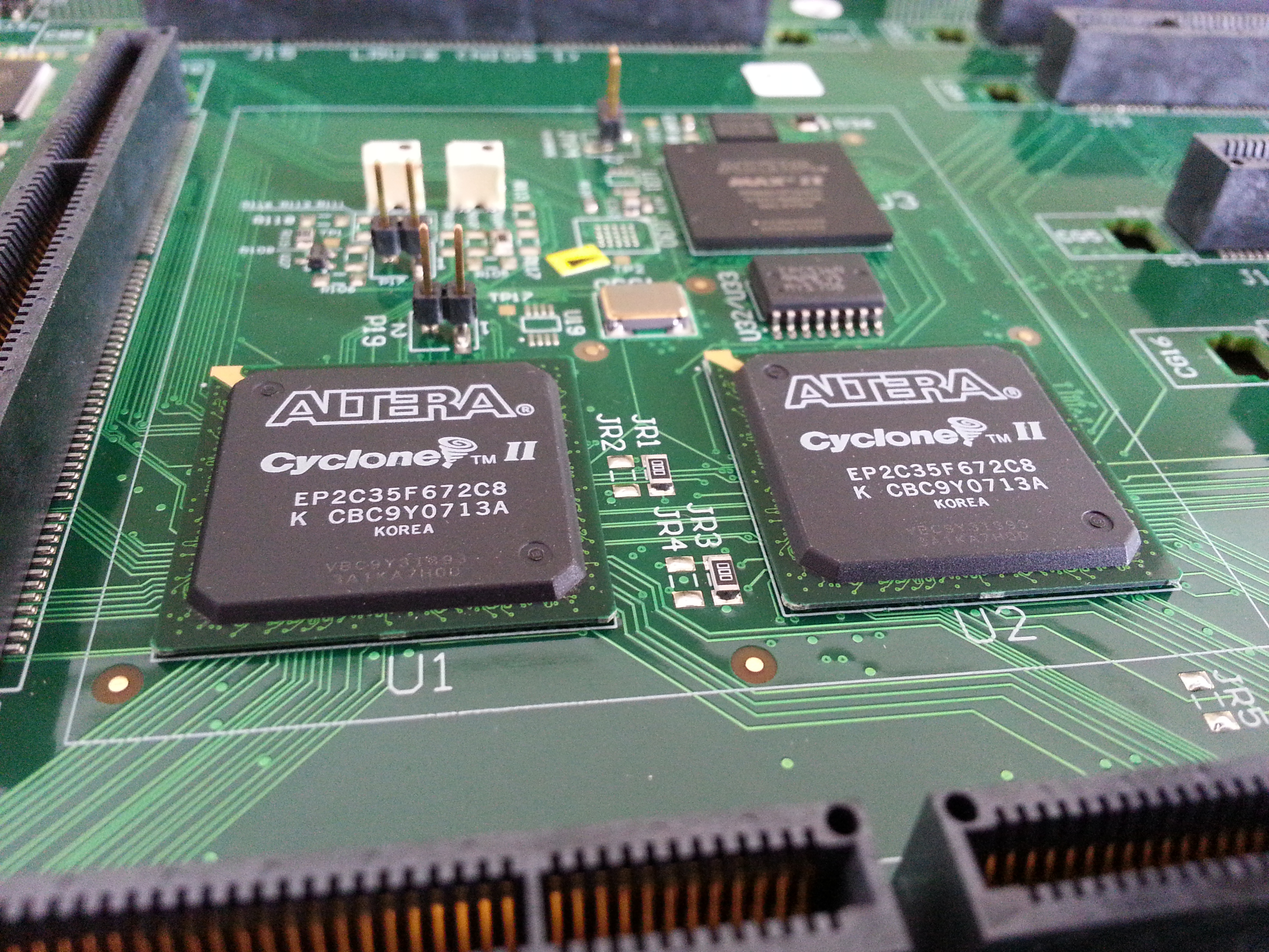 2 FPGA and PLD components on a motherboard.